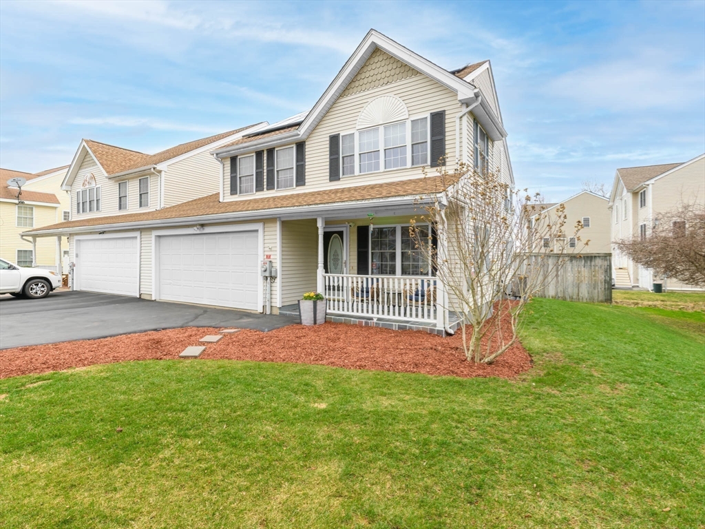 20 Angela Rose Lane Worcester, MA 01604 - Photo 2 of 35 a front view of a house with a yard and porch