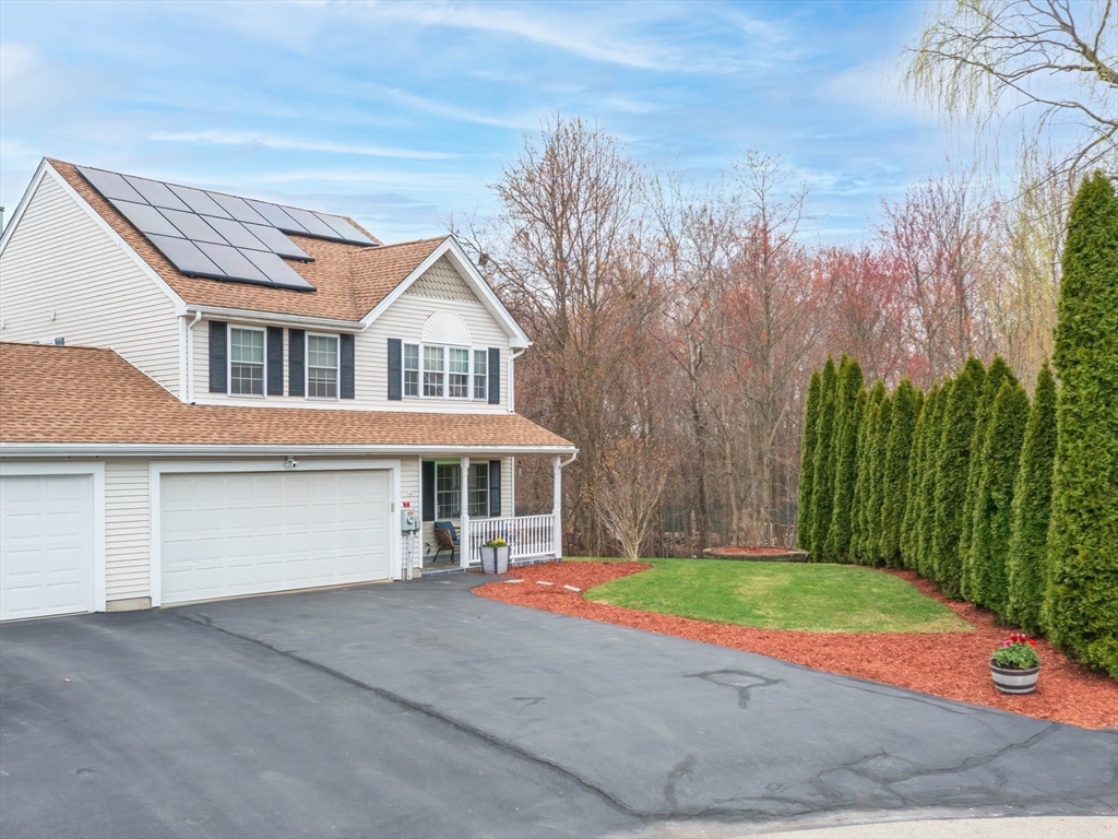 20 Angela Rose Lane Worcester, MA 01604 - Photo 3 of 35 a front view of a house with a yard and garage