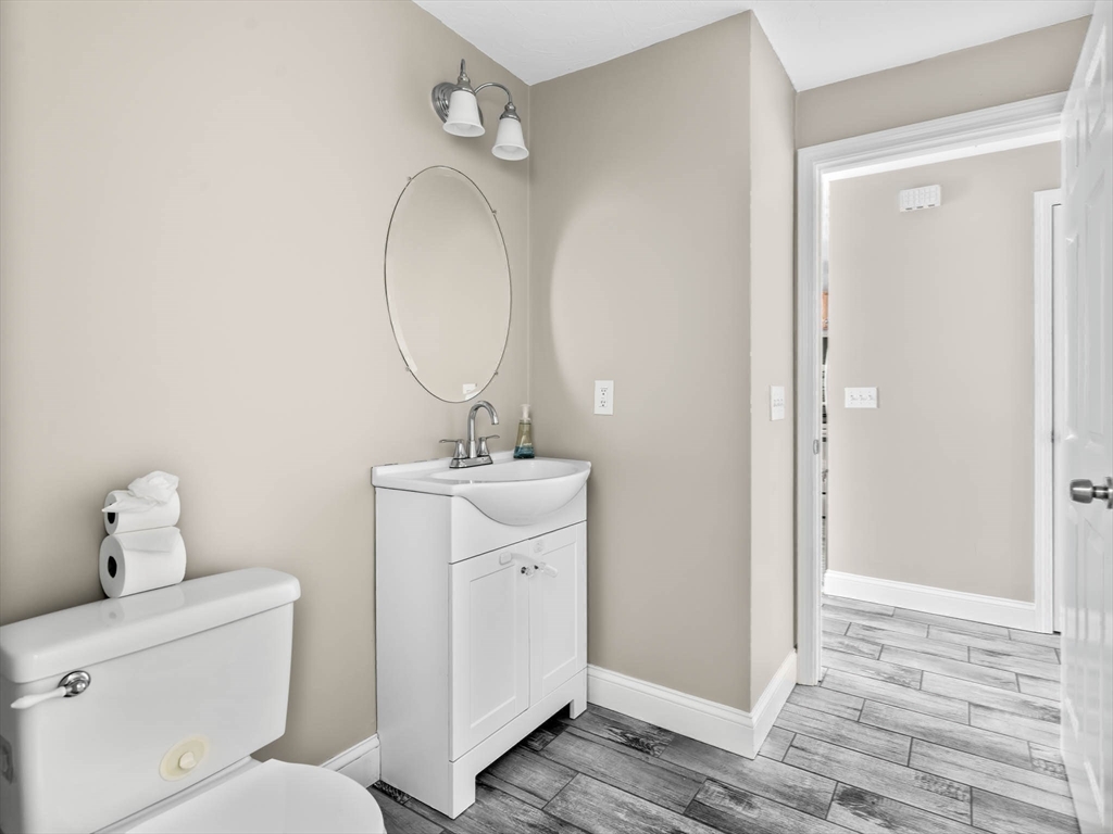 20 Angela Rose Lane Worcester, MA 01604 - Photo 32 of 35 a bathroom with a toilet sink and mirror