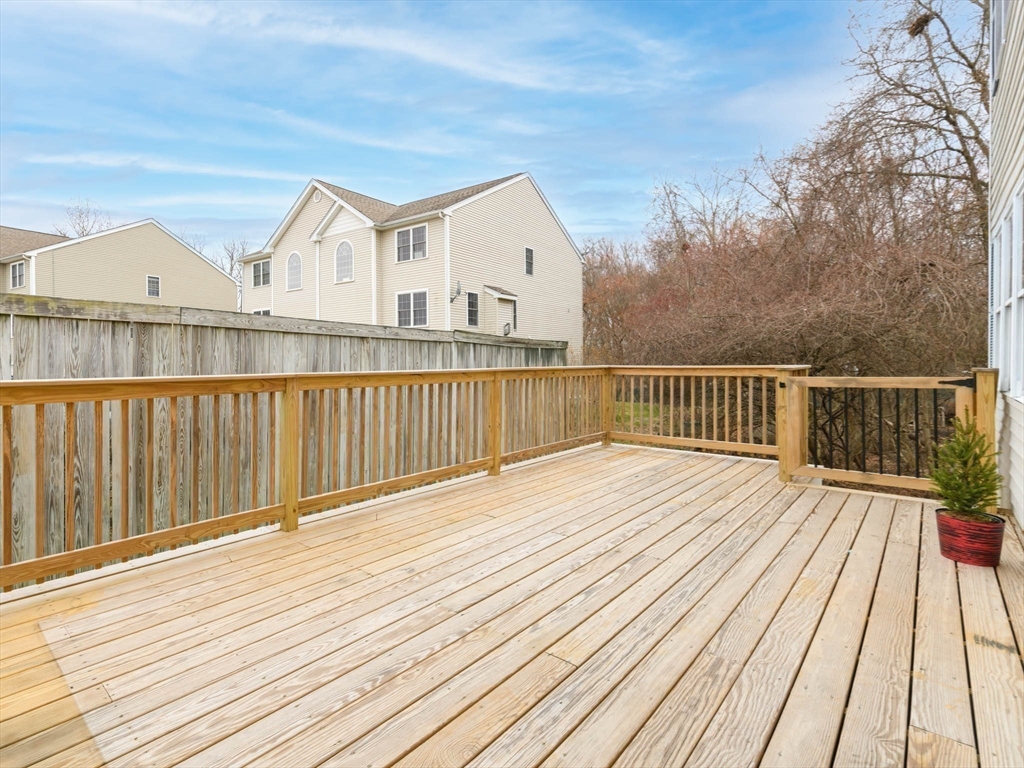 20 Angela Rose Lane Worcester, MA 01604 - Photo 7 of 35 a view of a wooden deck with a yard