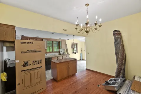 a kitchen with a sink stove and refrigerator