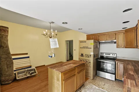 a view of a room with window & a ceiling fan