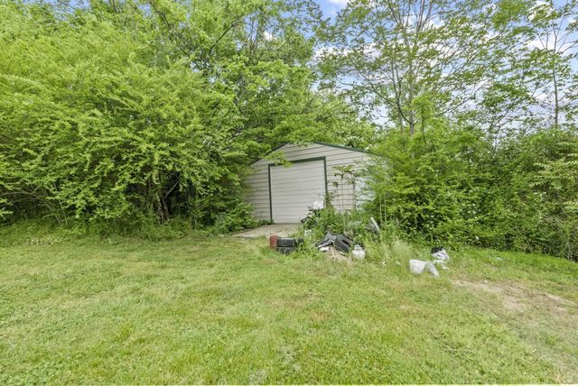a view of a forest with a houses