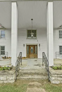 a view of an entryway with fireplace