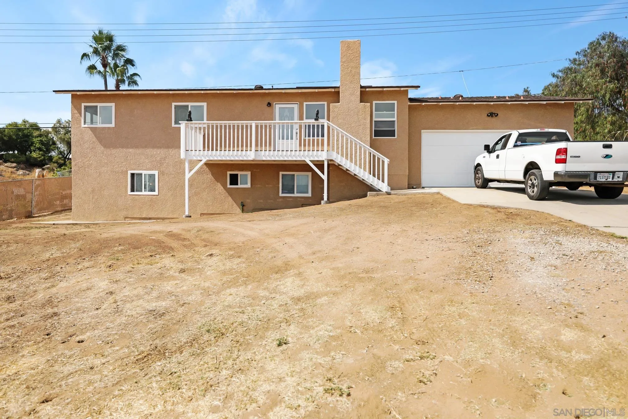 14668 Lyons Valley Road Jamul, CA 91935 - Photo 1 of 44 a front view of a house with a yard