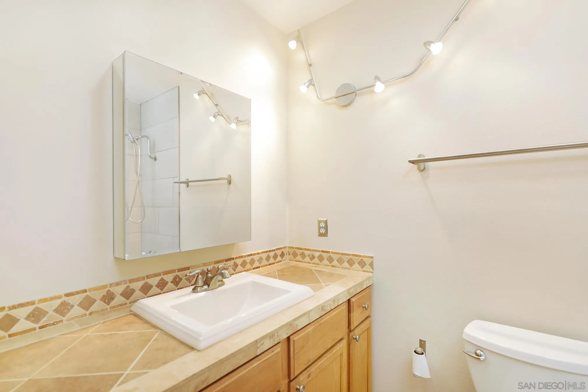 14668 Lyons Valley Road Jamul, CA 91935 - Photo 20 of 44 a bathroom with a sink and a mirror