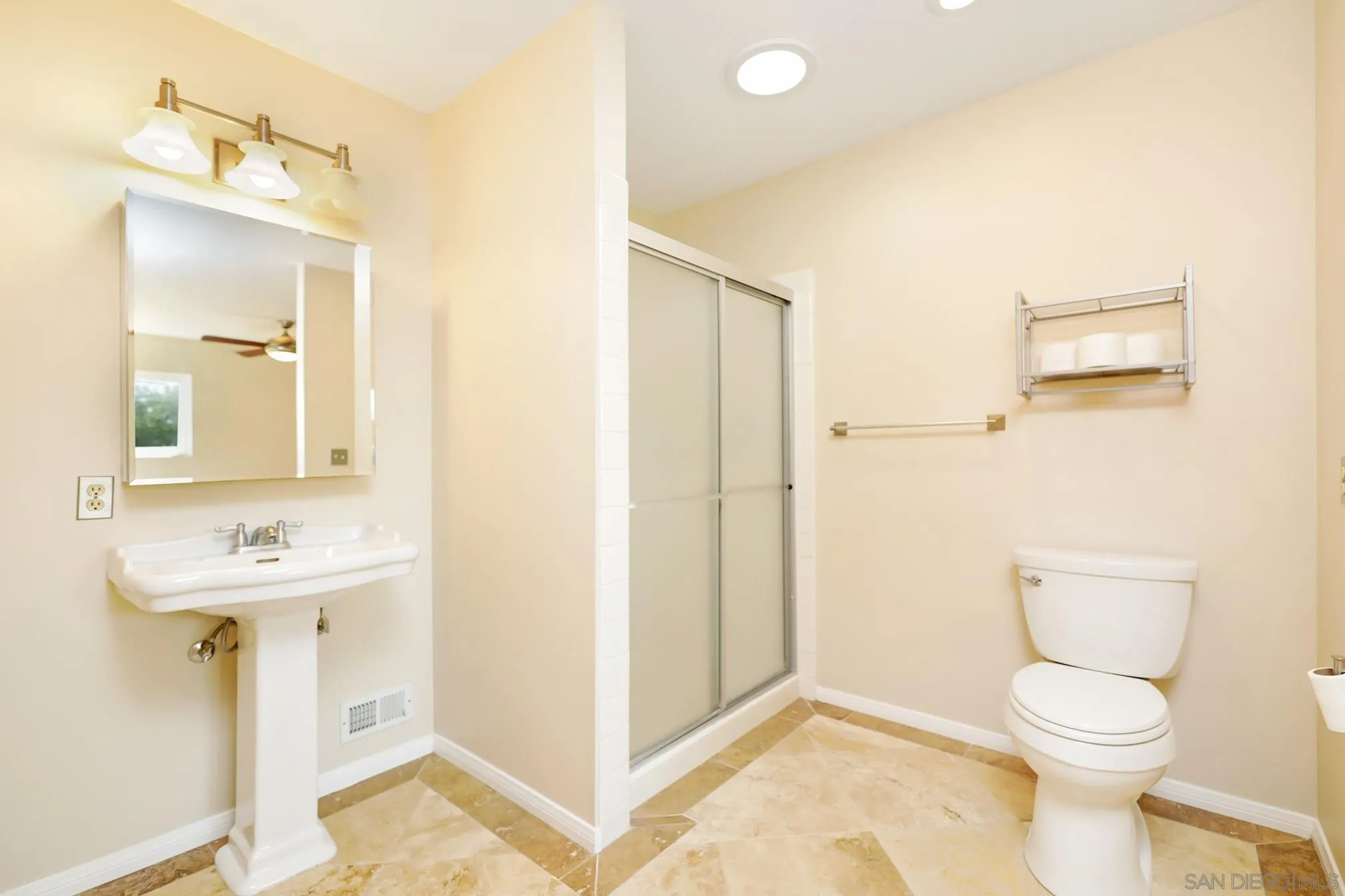 14668 Lyons Valley Road Jamul, CA 91935 - Photo 29 of 44 a bathroom with a toilet a sink and mirror