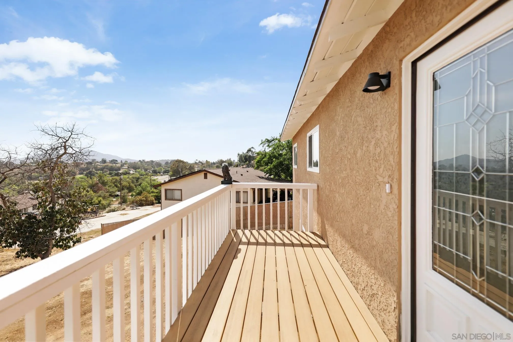 14668 Lyons Valley Road Jamul, CA 91935 - Photo 32 of 44 a view of a balcony with wooden floor and fence