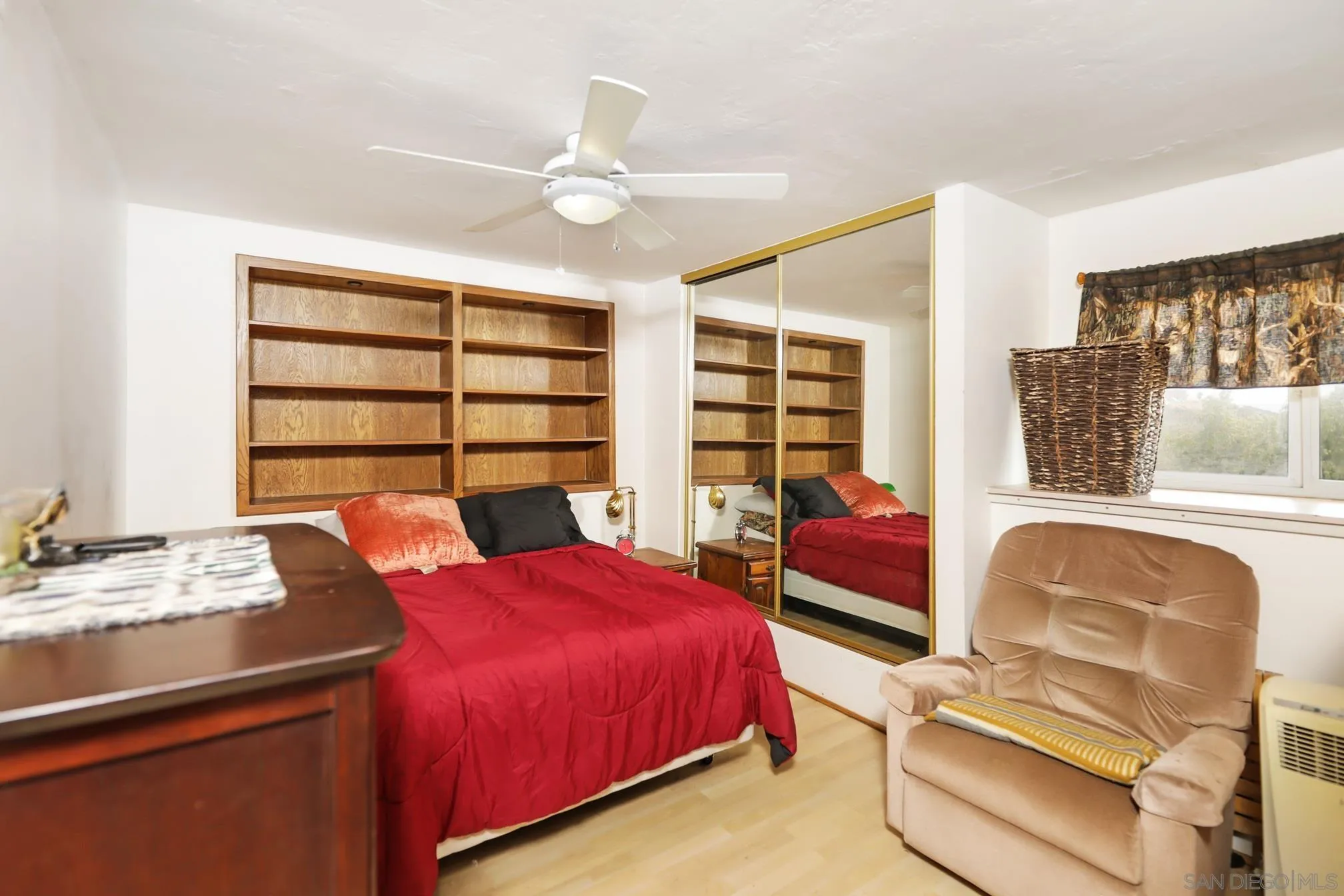 14668 Lyons Valley Road Jamul, CA 91935 - Photo 40 of 44 a bedroom with a bed and a chandelier