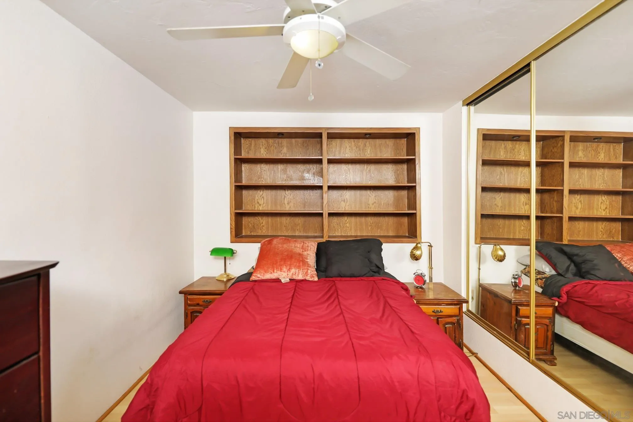 14668 Lyons Valley Road Jamul, CA 91935 - Photo 41 of 44 a bedroom with a bed and a chandelier