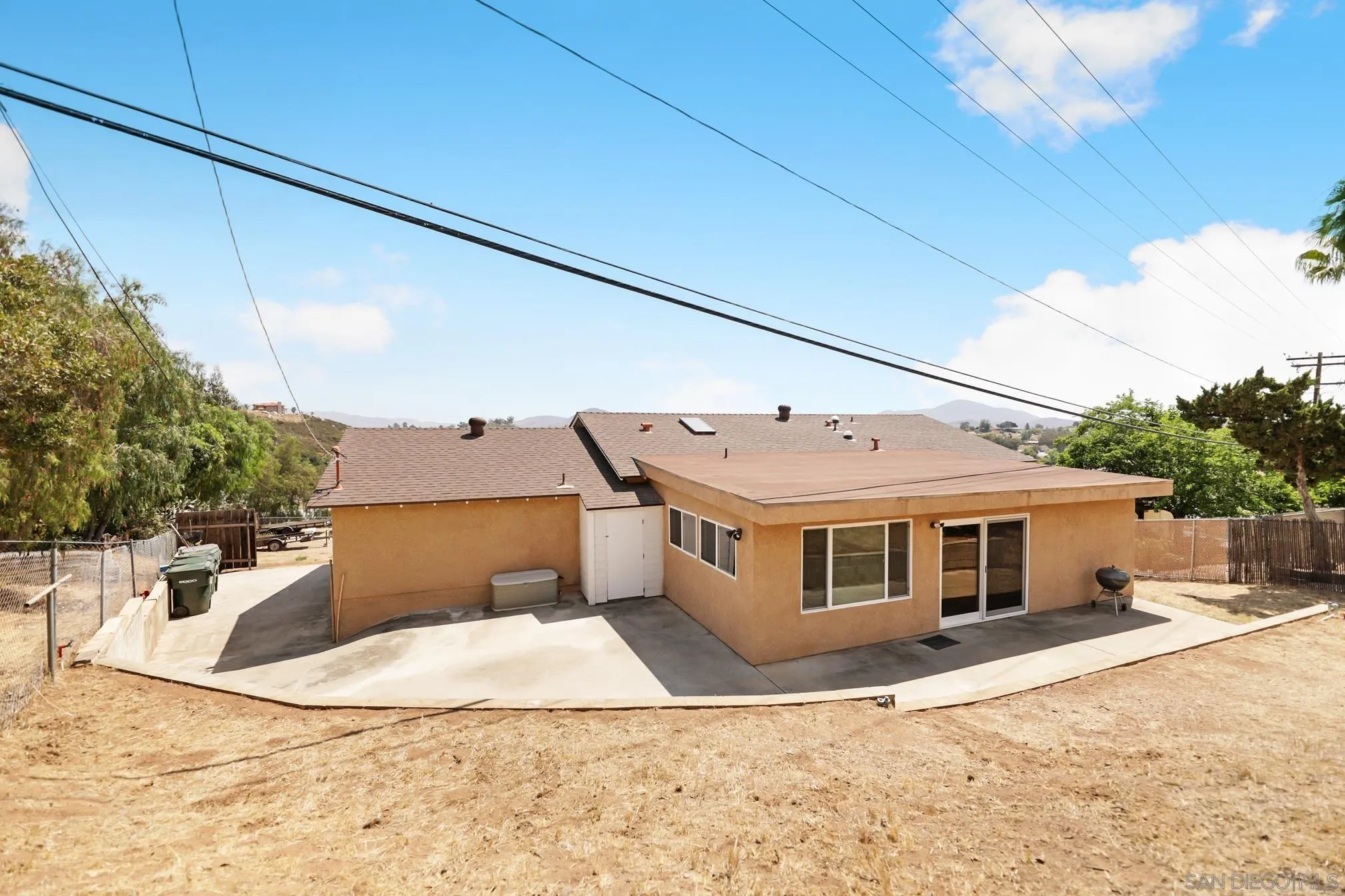 14668 Lyons Valley Road Jamul, CA 91935 - Photo 7 of 44 a front view of a house with a yard