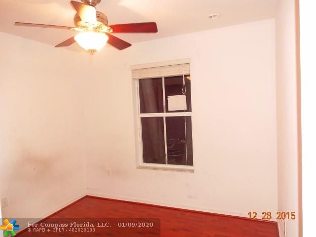 3052 Southwest 129th Terrace, Unit 114 Miramar, FL 33027 - Photo 9 of 12 DOWNSTAIRS BEDROOM