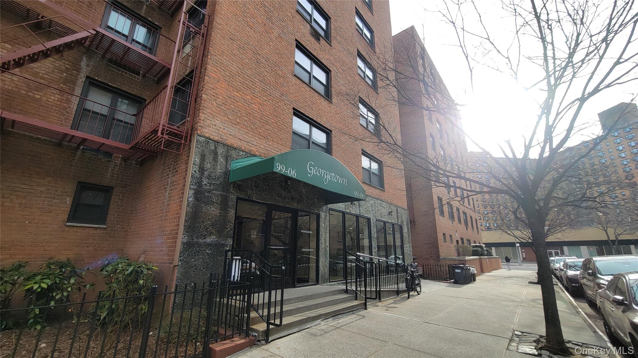99-06 58th Avenue, Unit 2F Queens, NY 11368 - Photo 3 of 24 a view of a building with a tree