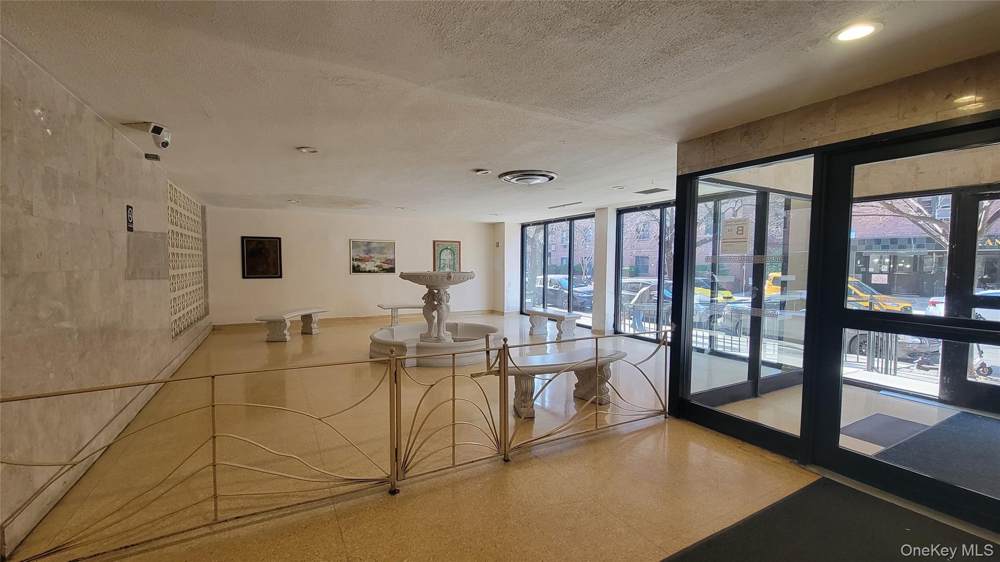 99-06 58th Avenue, Unit 2F Queens, NY 11368 - Photo 5 of 24 a living room with furniture