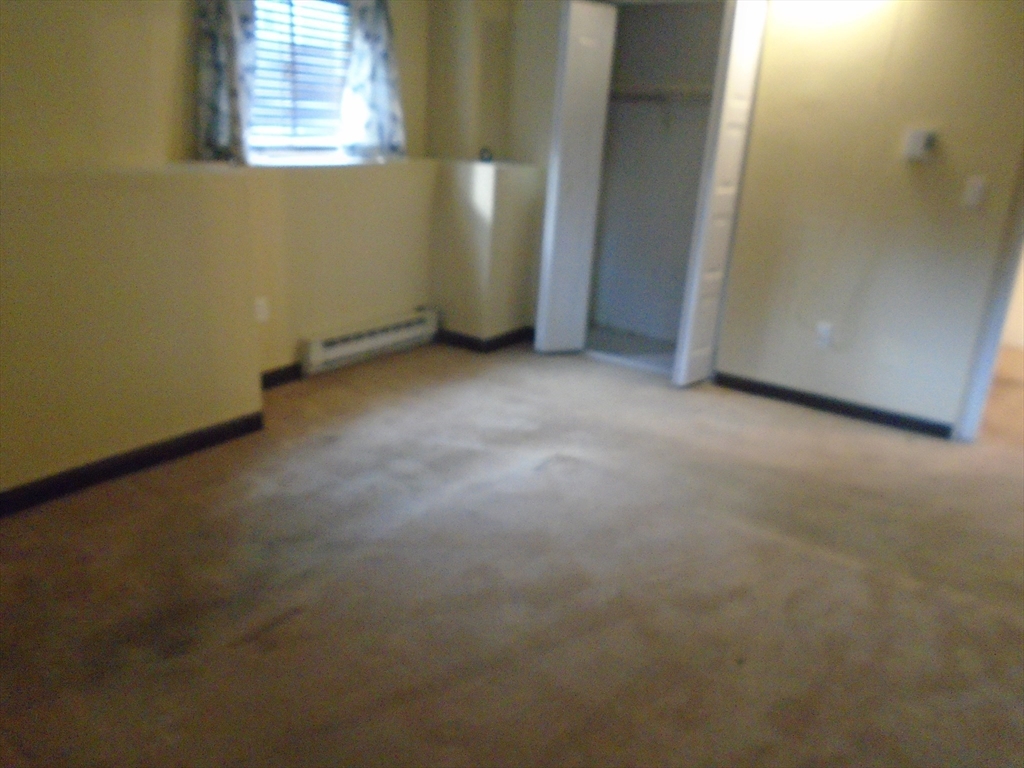 451 School Street, Unit 34 Marshfield, MA 02050 - Photo 11 of 18 an empty room with windows