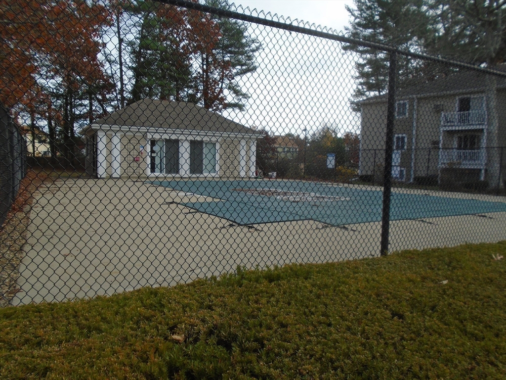 451 School Street, Unit 34 Marshfield, MA 02050 - Photo 18 of 18 a front view of a house with a garden