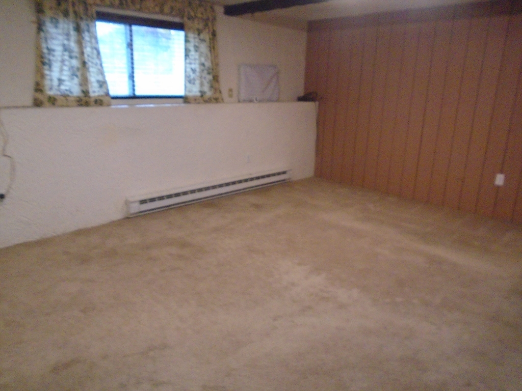 451 School Street, Unit 34 Marshfield, MA 02050 - Photo 3 of 18 an empty room with windows