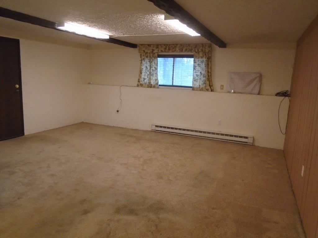 451 School Street, Unit 34 Marshfield, MA 02050 - Photo 4 of 18 en empty room with windows