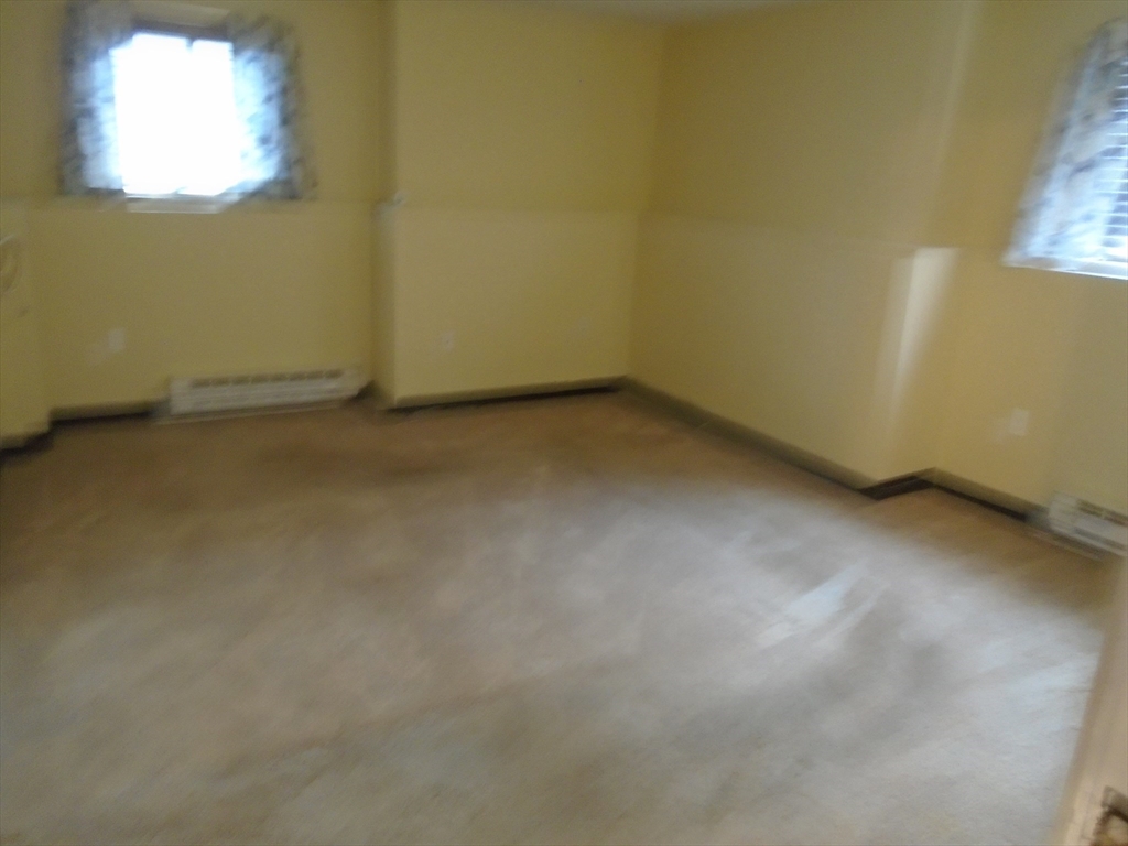 451 School Street, Unit 34 Marshfield, MA 02050 - Photo 10 of 18 an empty room with a window