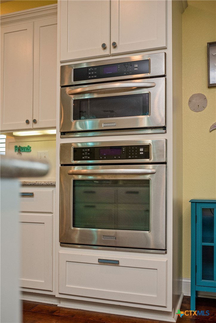 23 Macey Street Port O'Connor, TX 77982 - Photo 40 of 47 a stove top oven sitting inside of a kitchen