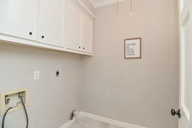 a kitchen with kitchen island granite countertop a sink stove and refrigerator