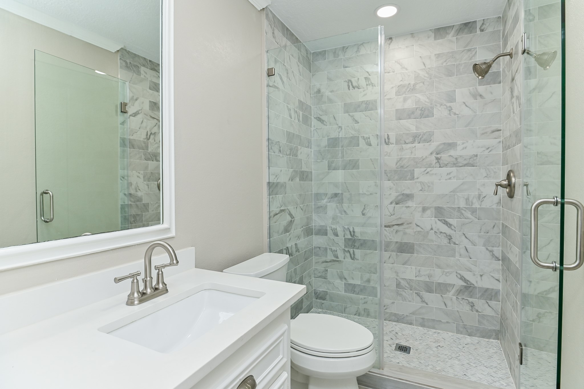 17910 Moss Point Drive Spring, TX 77379 - Photo 15 of 32 a bathroom with a sink a toilet and shower