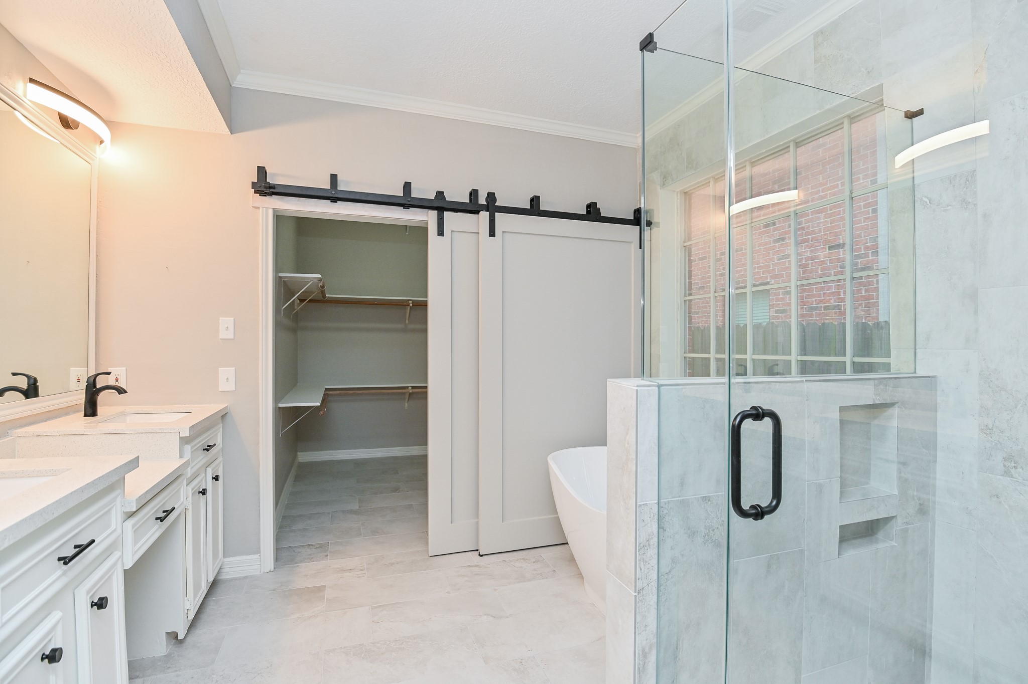 17910 Moss Point Drive Spring, TX 77379 - Photo 19 of 32 a bathroom with a double vanity sink a toilet and shower