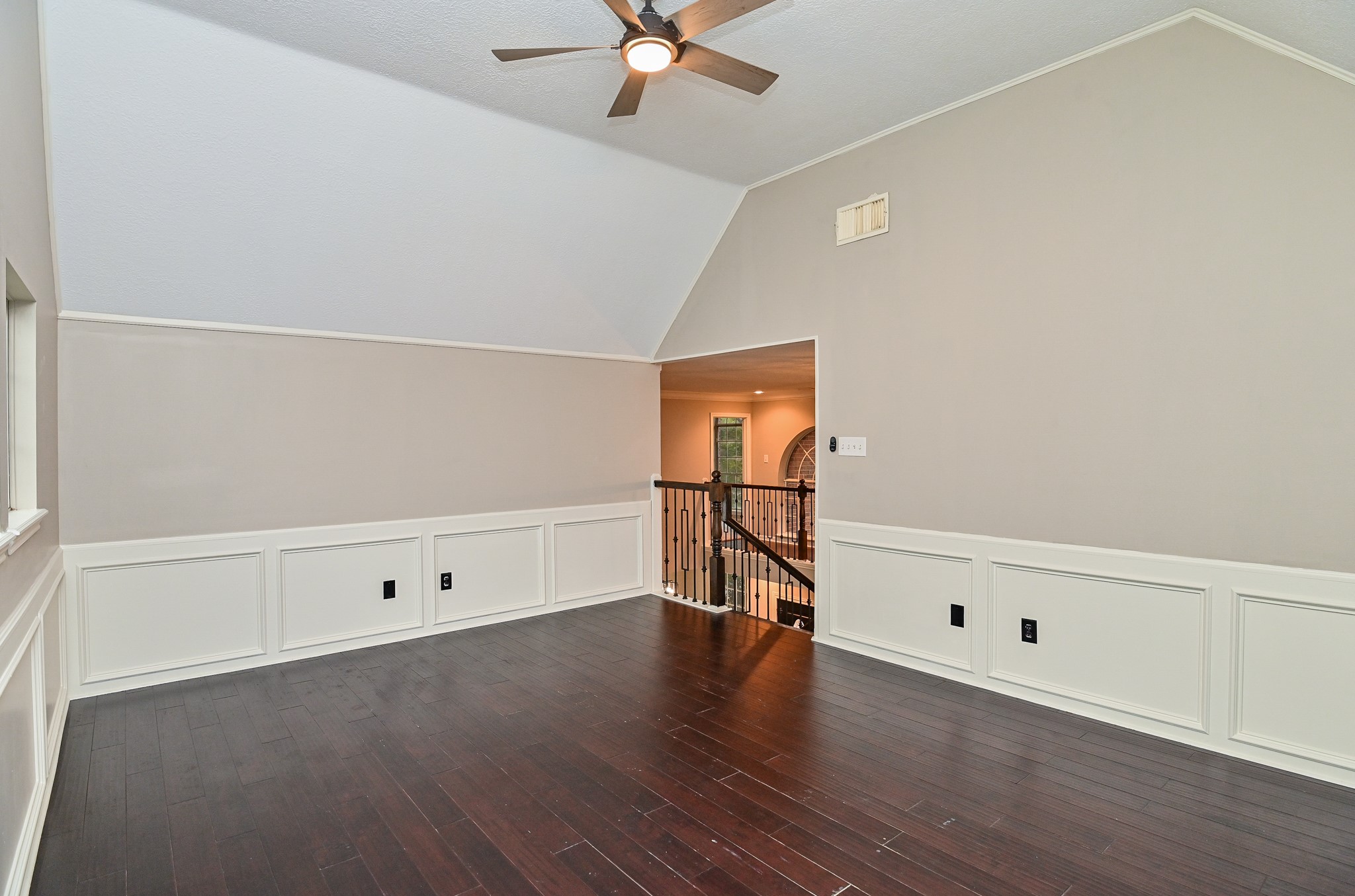 17910 Moss Point Drive Spring, TX 77379 - Photo 24 of 32 an empty room with wooden floor and cabinet