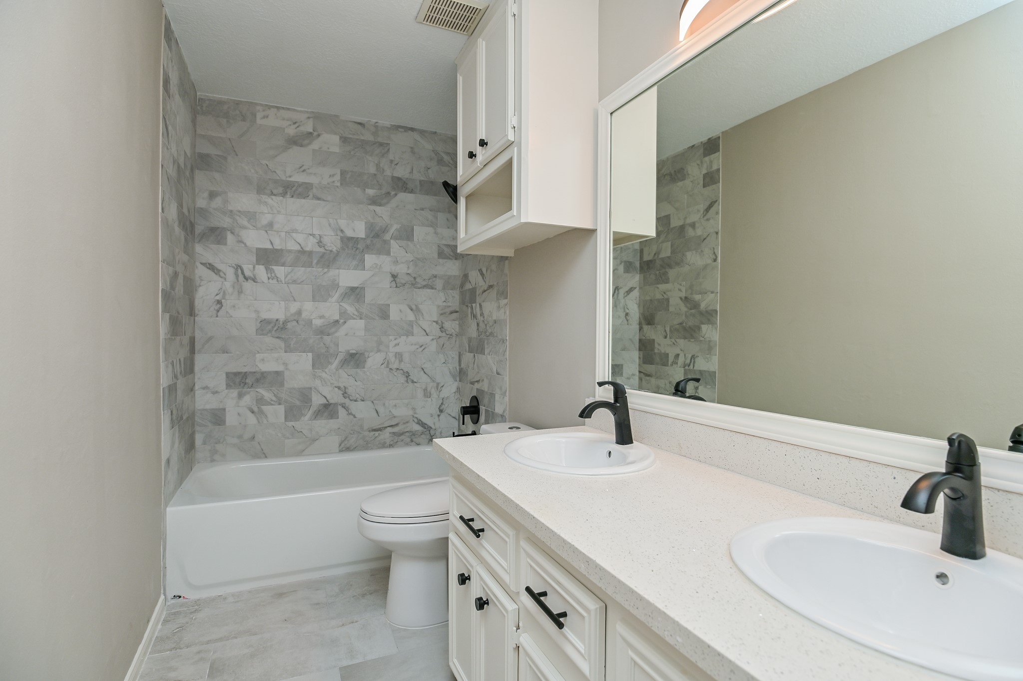 17910 Moss Point Drive Spring, TX 77379 - Photo 27 of 32 a bathroom with a sink a toilet and shower