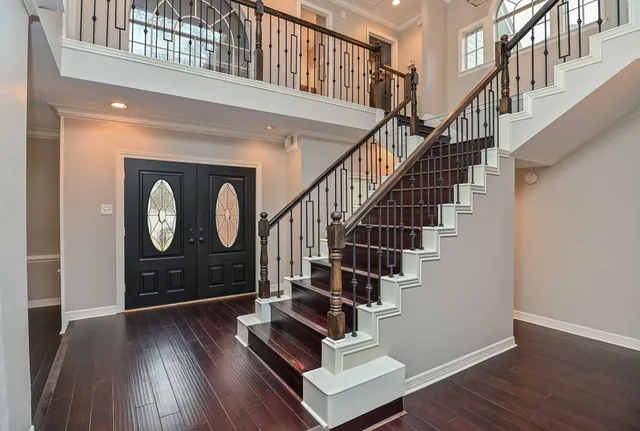 a view of entryway with wooden floor and door