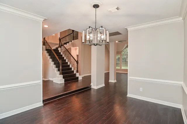 a front view of house with a garden