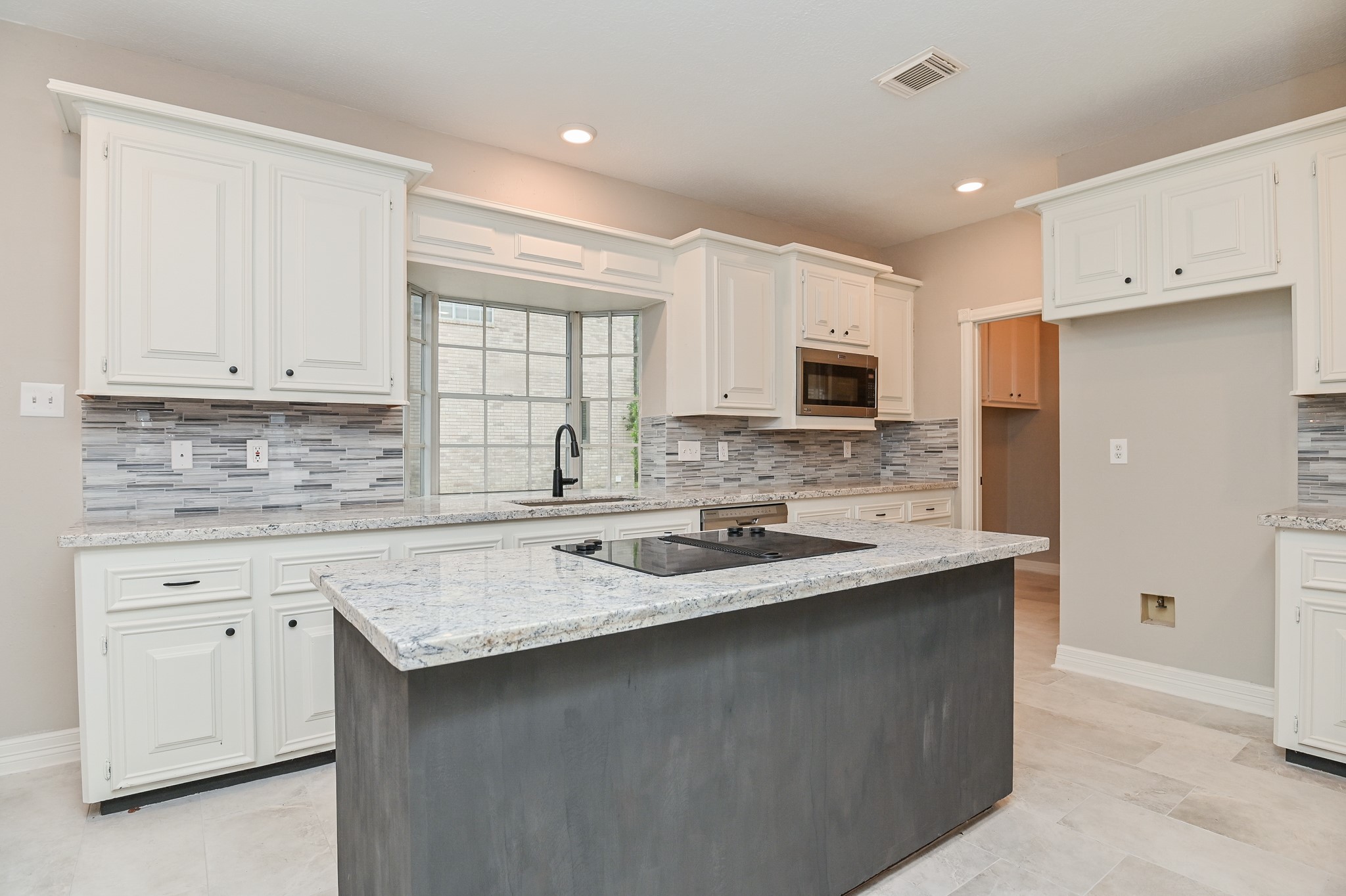 17910 Moss Point Drive Spring, TX 77379 - Photo 9 of 32 a kitchen with stainless steel appliances granite countertop a sink stove and microwave
