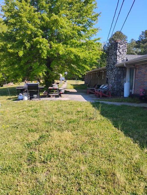 392 Nickelsville Road Northeast Resaca, GA 30735 - Photo 2 of 14 a view of a house with backyard and sitting area