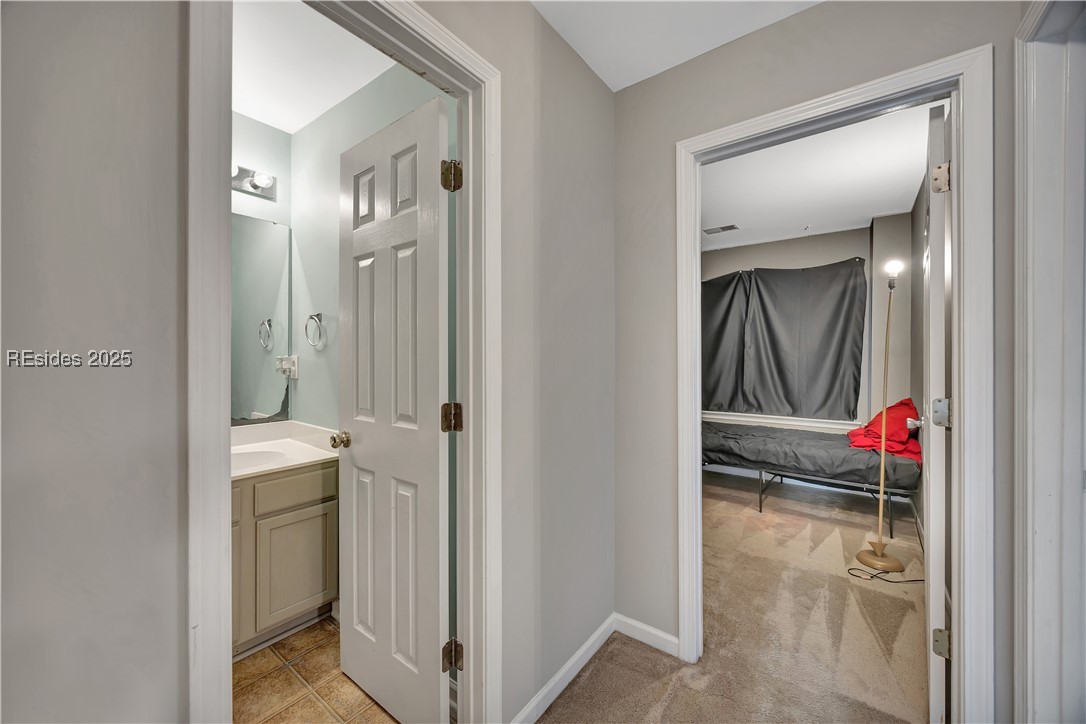 230 West Square Bluffton, SC 29910 - Photo 25 of 27 Hallway from guest bath to guest bedroom