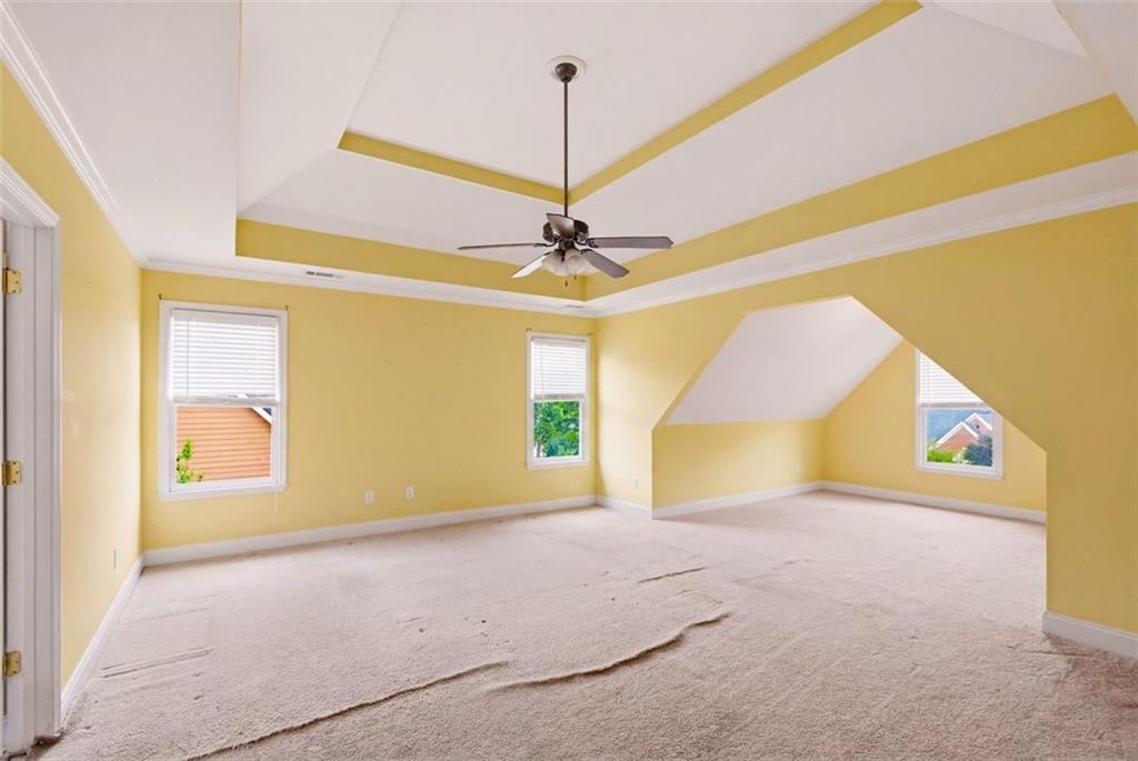 3420 Bulloch Lake Road Loganville, GA 30052 - Photo 31 of 57 a view of a room with a windows and ceiling fan
