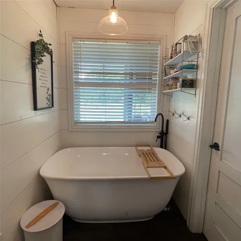 a bathroom with a sink and bathtub