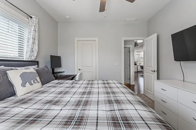 a bathroom with a sink a toilet and shower curtain