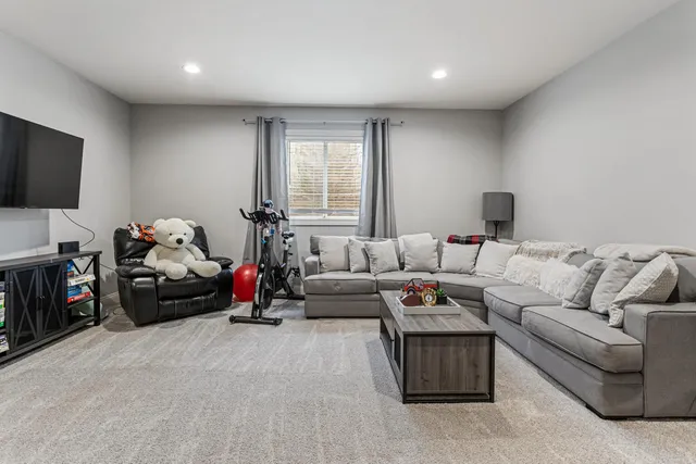 a bedroom with a bed and a couch