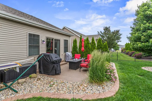 a view of a yard with furniture