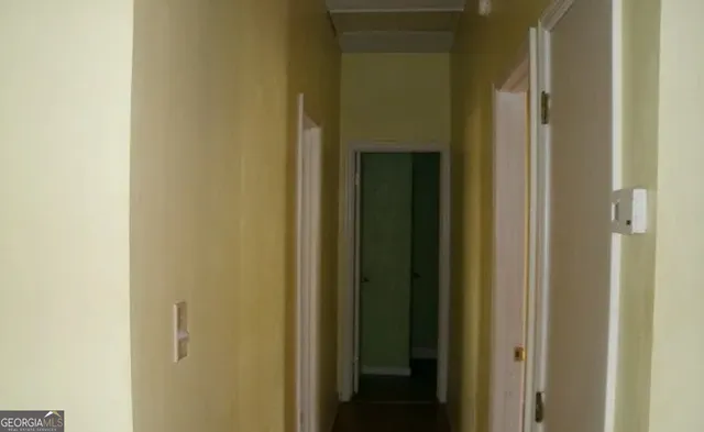 a view of a bathroom from a hallway