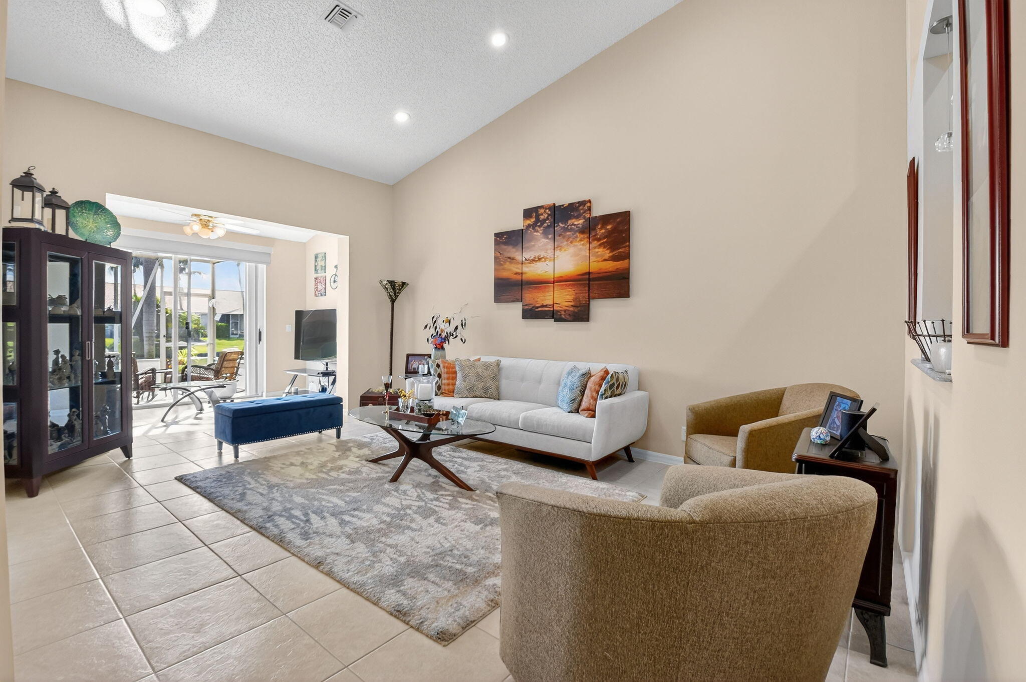 6210 Heliconia Road Delray Beach, FL 33484 - Photo 20 of 53 a living room with furniture and a flat screen tv