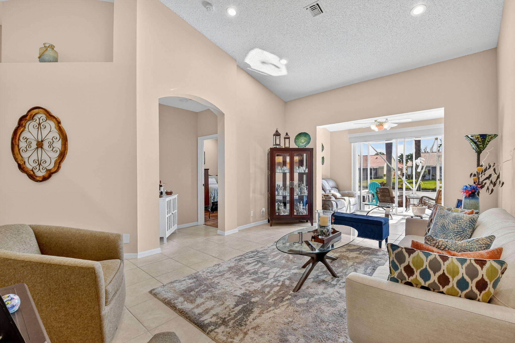 6210 Heliconia Road Delray Beach, FL 33484 - Photo 21 of 53 a living room with furniture and a large window