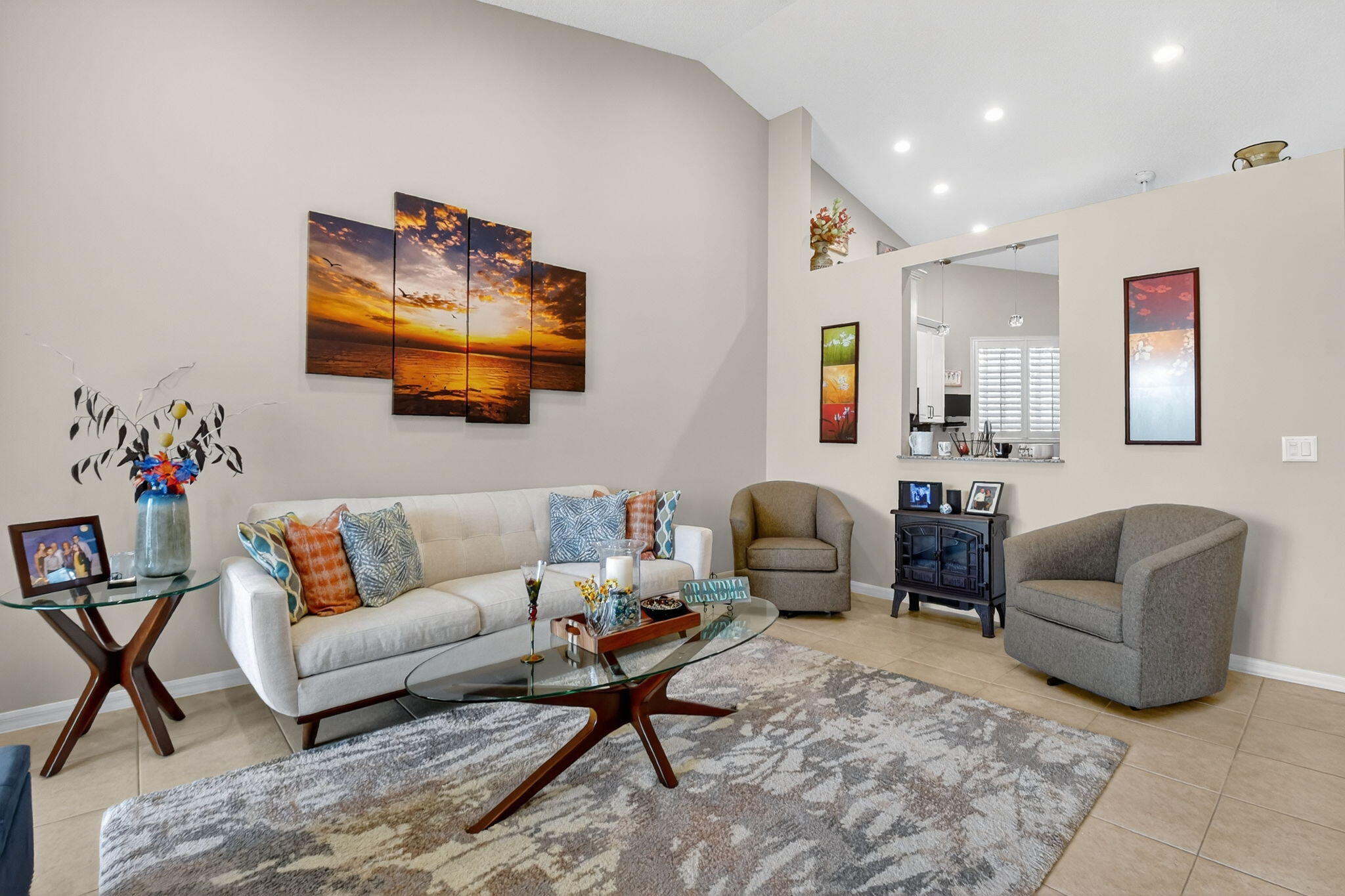 6210 Heliconia Road Delray Beach, FL 33484 - Photo 23 of 53 a living room with furniture and a flat screen tv