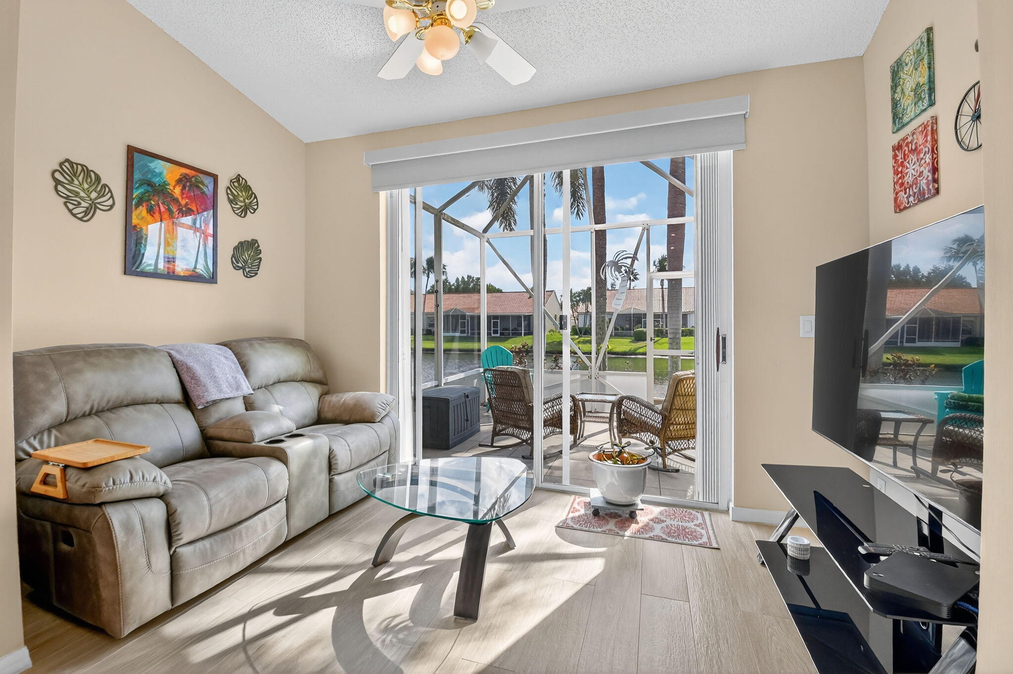 6210 Heliconia Road Delray Beach, FL 33484 - Photo 26 of 53 a living room with furniture and a flat screen tv
