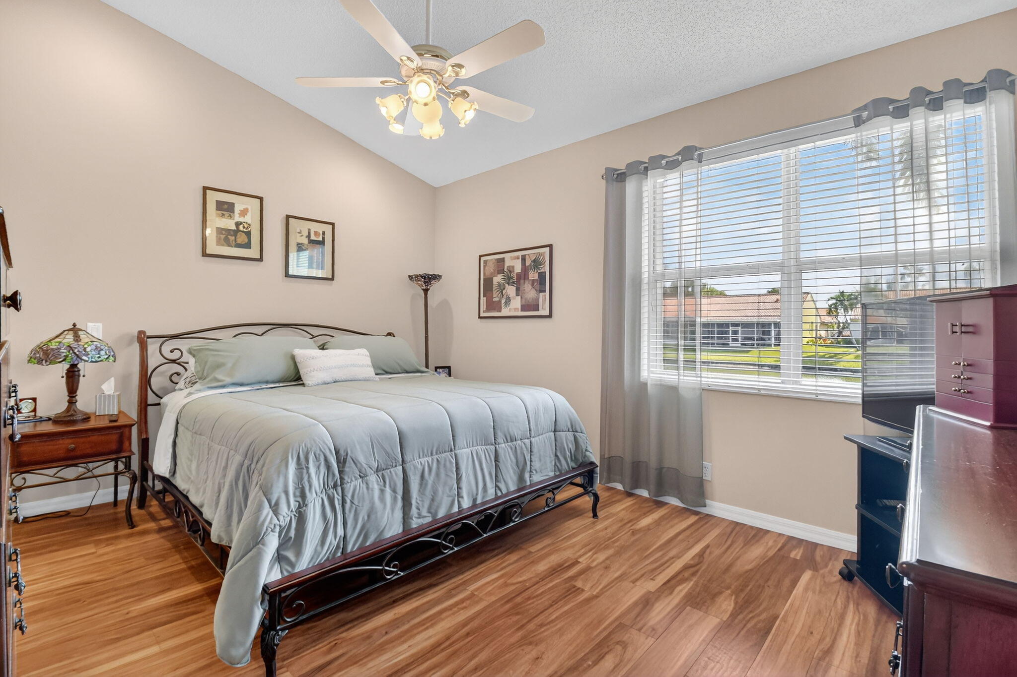 6210 Heliconia Road Delray Beach, FL 33484 - Photo 29 of 53 a bedroom with a large bed and a window