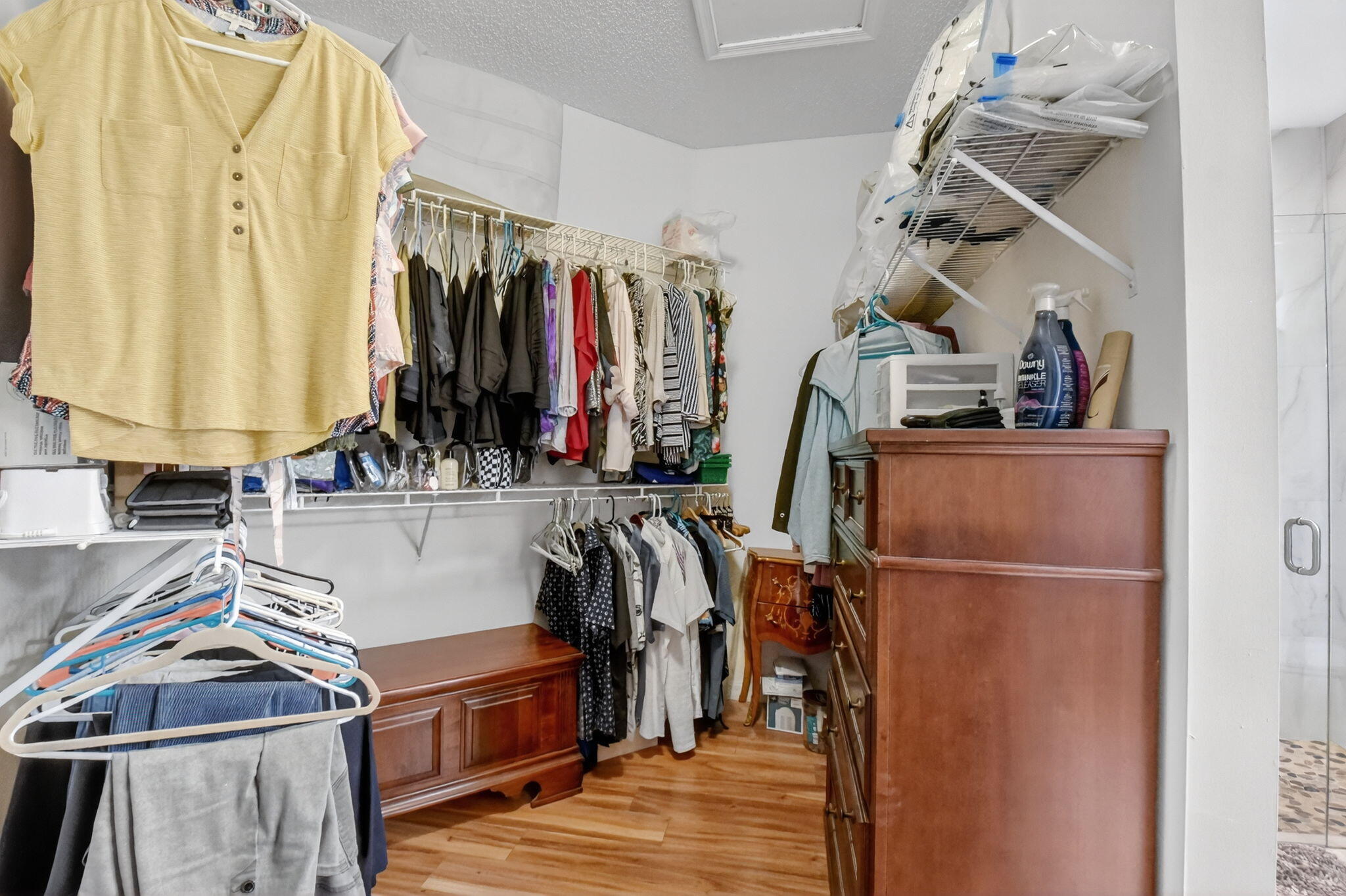 6210 Heliconia Road Delray Beach, FL 33484 - Photo 36 of 53 a view of walk in closet with clothes and shoes