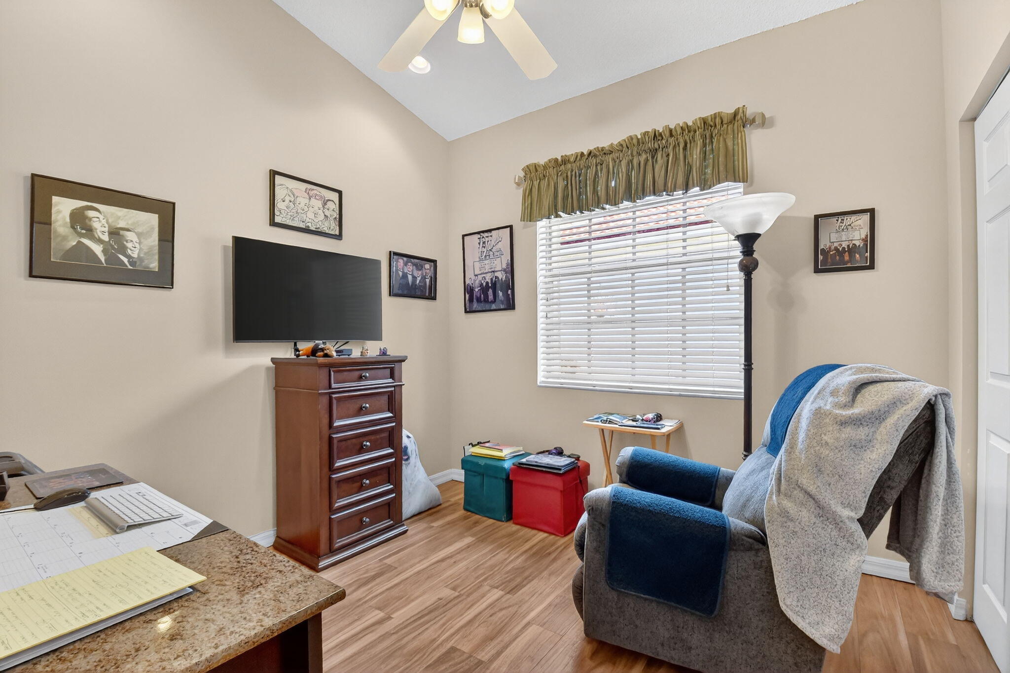 6210 Heliconia Road Delray Beach, FL 33484 - Photo 37 of 53 a room with furniture and a flat screen tv