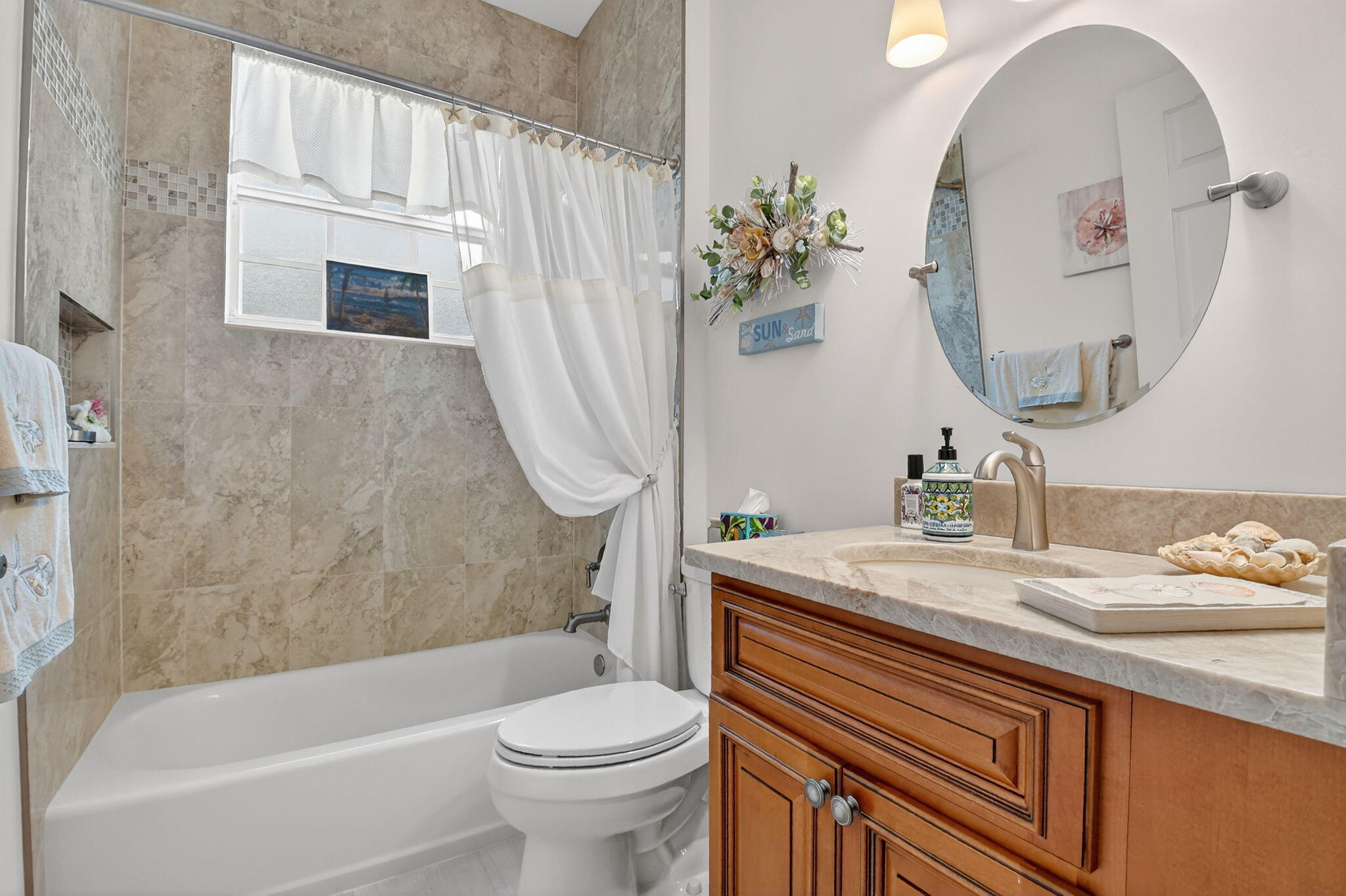 6210 Heliconia Road Delray Beach, FL 33484 - Photo 39 of 53 a bathroom with a sink a toilet and a mirror