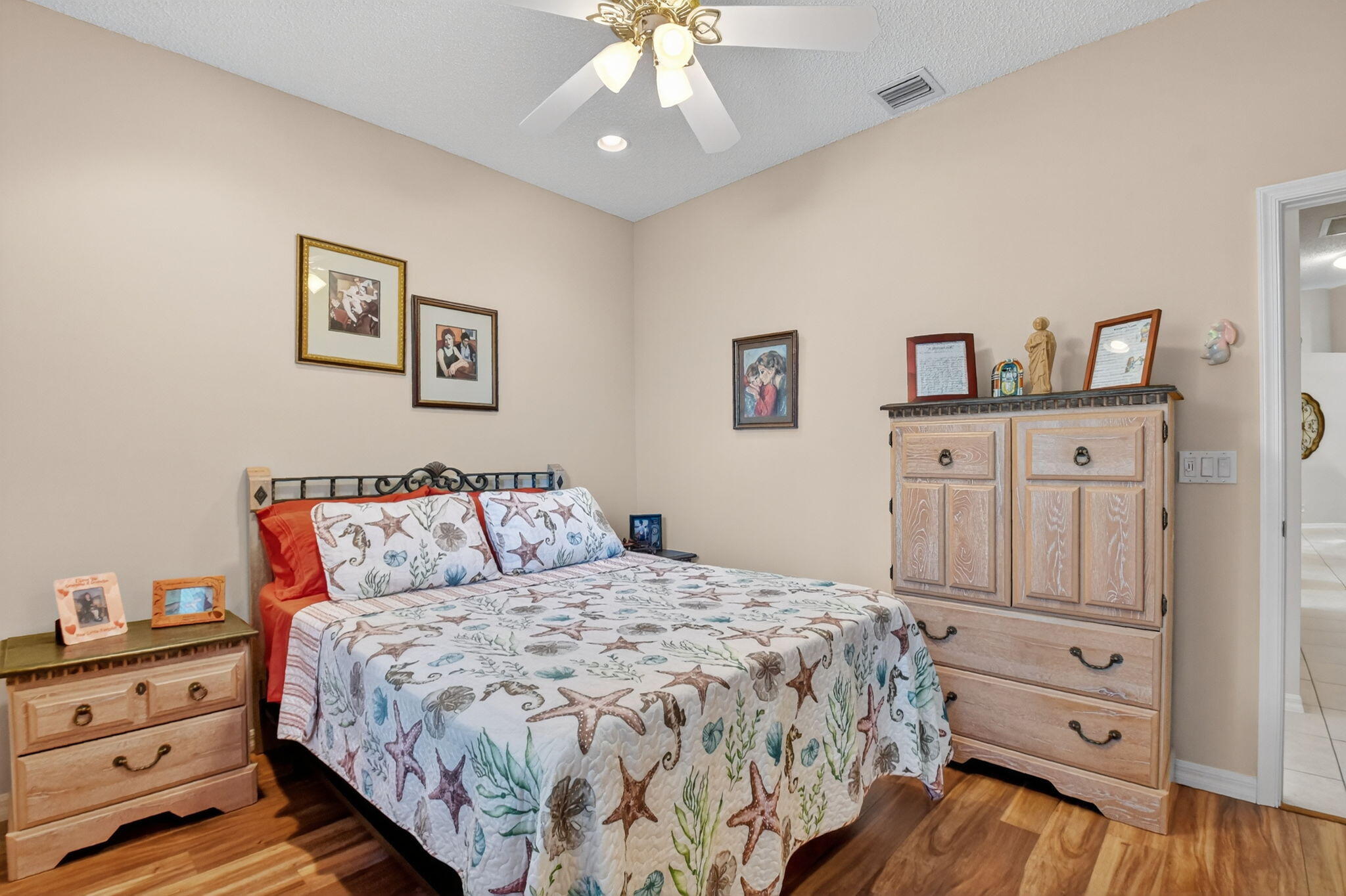 6210 Heliconia Road Delray Beach, FL 33484 - Photo 42 of 53 a bedroom with a bed and a dresser