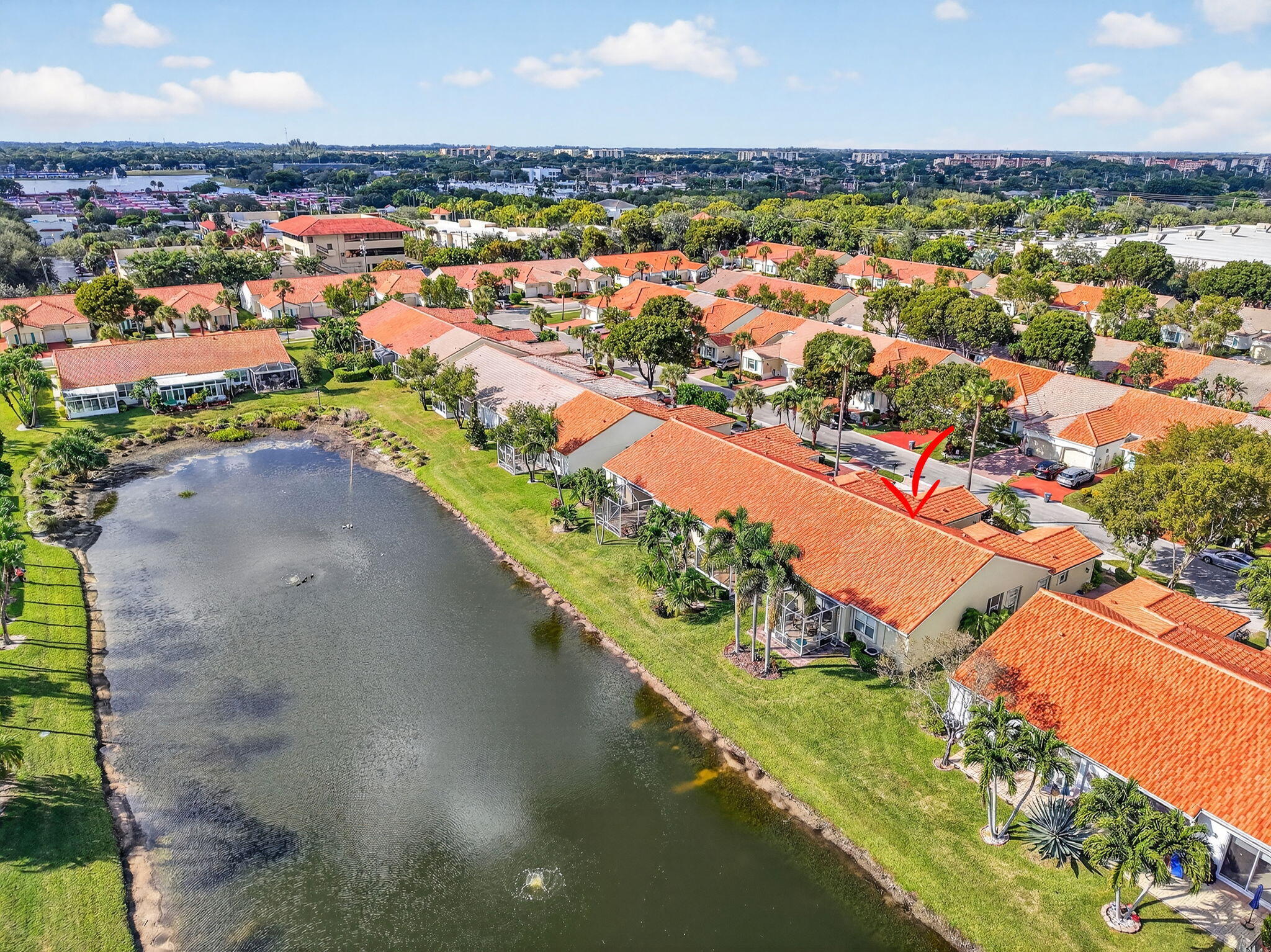 6210 Heliconia Road Delray Beach, FL 33484 - Photo 50 of 53 an aerial view of a city with lots of residential buildings ocean and mountain view in back